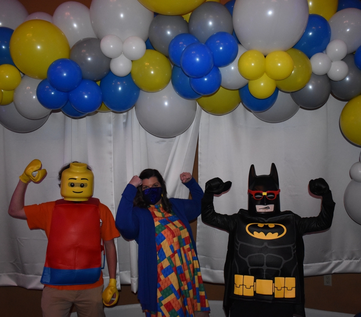 Kids and teacher dressed as LEGO superheroes